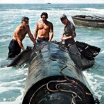 US Navy inspecting Kaiten remains in water-colorized