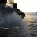 Aft of AO59 burning when Munsee arrived - colorized