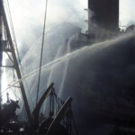 Water poured on burning AO-59 - Colorized (taken by Sid Harris)